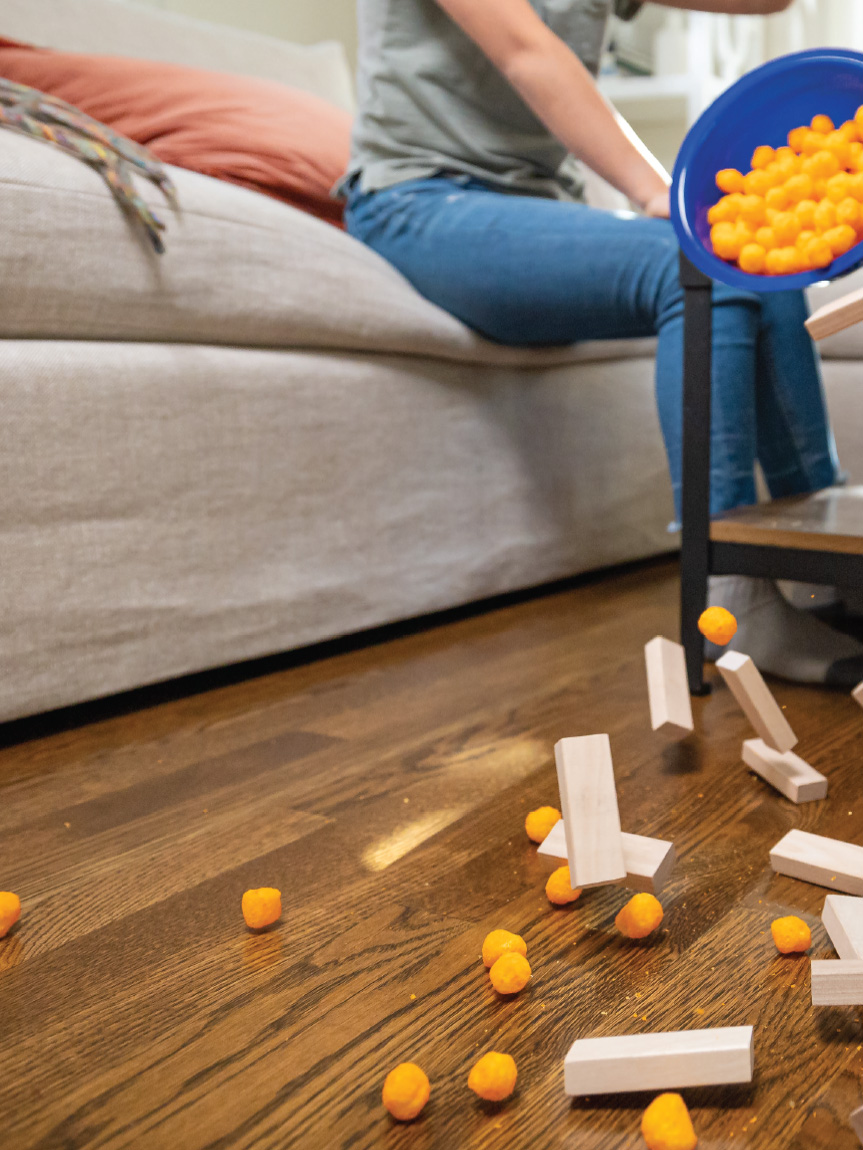 Mom and daughter playing with tablet on hard surface floors